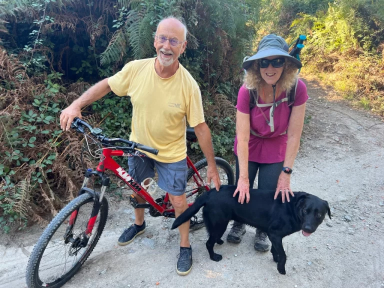 Roger and his dog Midnight on the mountain trail approaching Porto