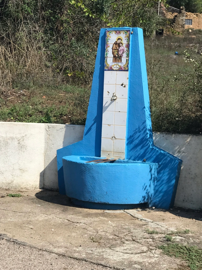 water font with a saint