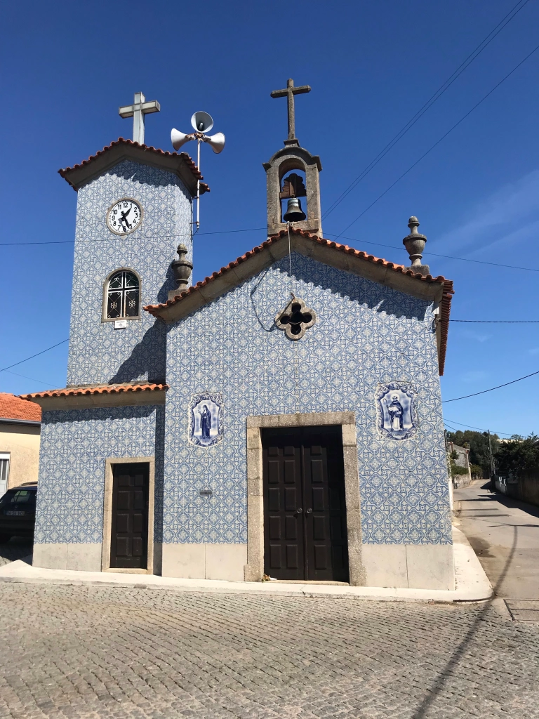 small village church is also covered in blue tiles