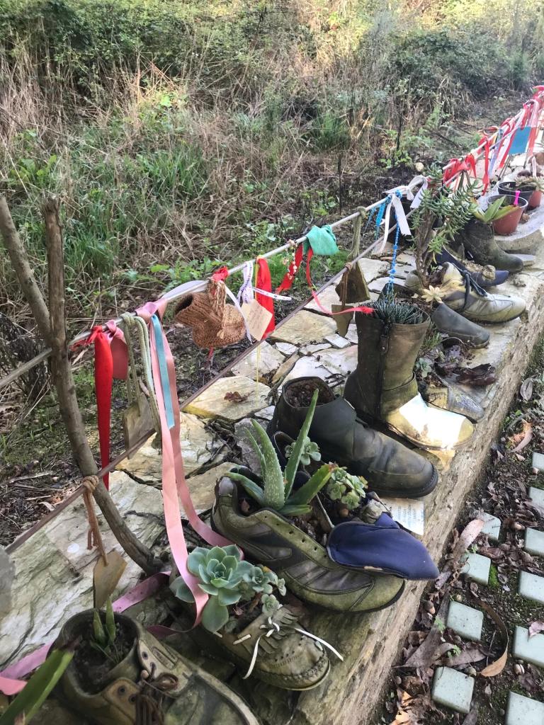 trailside garden in discarded shoes