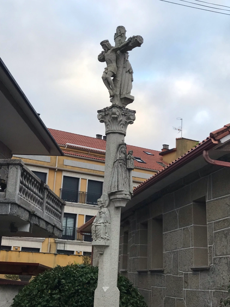 stone figures on cross