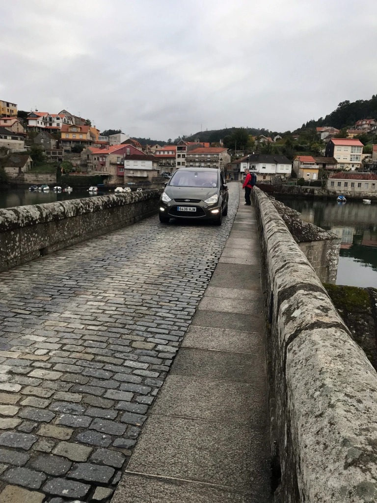 pedestrians and cars share the bridge