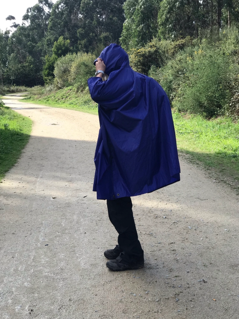 rain poncho over the pack--a hunchback